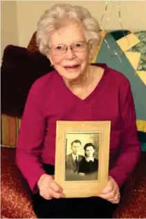  ?? Rumore, SDN) (Photo by Mary ?? 103-year-old Ethel Wilson holds her wedding photo from 1940 of her and her late husband Arlie Wilson.