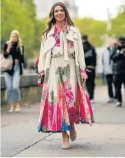  ?? Picture: EDWARD BERTHELOT/GETTY IMAGES ?? IN VOGUE: Blogger Negin Mirsalehi wears a bright print during Paris Fashion Week in September
