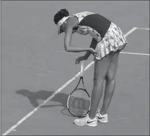  ?? The Associated Press ?? NO TIME TO REST: Venus Williams of the U.S. leans on her racket after missing a shot against Timea Bacsinszky of Switzerlan­d during their fourth round match of the French Open at the Roland Garros stadium in Paris, France. Sunday. Williams fell to...