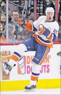  ?? AP ?? 2ND EFFORT: Jason Chimera celebrates after scoring what proves to be the game-winning goal in the second period of the Islanders’ 3-1 victory over the Flyers.