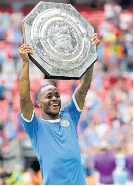  ?? AP ?? Jamaica-born Manchester City goalscorer Raheem Sterling lifts the trophy after the English Community Shield match between Liverpool and Manchester City at Wembley Stadium in London, yesterday. City won 5-4 on penalties after a 1-1 regulation time scoreline.