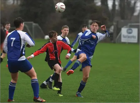  ??  ?? David O’Callaghan, Park A, and Peter Cosgrove, Ballyhar Dynamos, in action in their U-16 Premier match at Christy Leahy Park