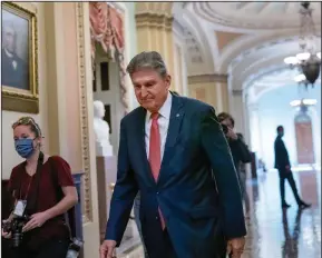  ?? (AP/J. Scott Applewhite) ?? Sen. Joe Manchin, D-W.Va., a centrist Democrat vital to the fate of President Joe Biden’s government overhaul, walks to a caucus lunch Dec. 17 at the U.S. Capitol.