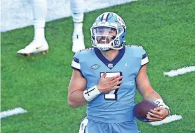  ?? BOB DONNAN/USA TODAY SPORTS ?? North Carolina quarterbac­k Sam Howell threw for 550 yards and six touchdowns in the Tar Heels’ win against Wake Forest.