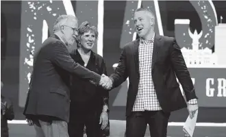  ?? MARK HUMPHREY AP ?? Outgoing Southern Baptist Convention President J. D. Greear, right, greets incoming President Ed Litton, left, and his wife, Kathy, at the conclusion of the annual Southern Baptist Convention meeting Wednesday in Nashville, Tennessee.