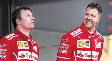  ?? GETTY IMAGES ?? Die Ferrari-piloten Kimi Räikkönen (l.) und Sebastian Vettel sind ein Herz und eine Seele.