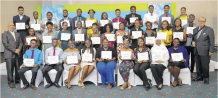  ??  ?? The 2019 cohort of the Sagicor Foundation tertiary scholarshi­p awardees are photograph­ed with Christophe­r Zacca (left, front row), president and CEO of Sagicor Group Jamaica, and R Danny Williams (right, front row), chairman of the Sagicor Foundation at last year’s Sagicor Foundation Scholarshi­p Awards ceremony at Jamaica Pegasus hotel.