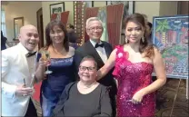  ?? Matt Fernandez/The Signal ?? Mul Tayoba, left, Myra Miranda, right, and other guests celebrate at the Filipino American Associatio­n of Santa Clarita Valley gala Saturday at the Hyatt Regency Valencia.