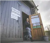  ?? MATT CARDY / GETTY IMAGES FILES ?? A British woman leaves a polling station after voting in the village of Mells in Somerset, England.