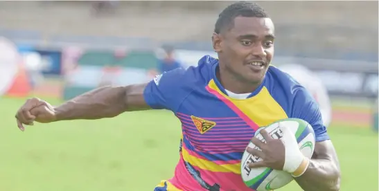  ?? Photo: ?? Kaminieli Rasaku on his way to score a try for Tabadamu against Nasogoceva during pool play of the Fiji Bitter Marist 7s tournament at the ANZ Stadium, Suva, on March 26, 2021.