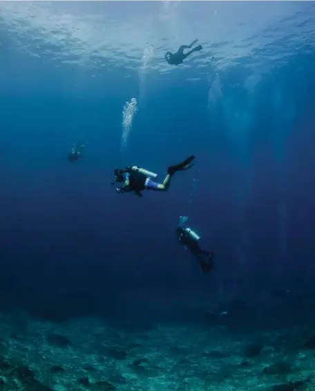  ?? Caine Delacy / NYT ?? Experts say adventurou­s and active travelers, like these scuba divers in the Andaman Sea off Thailand, should buy a travel insurance plan that offers coverage for hazardous and adventure sports.