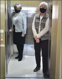  ?? Staff photo/Jake Dowling ?? St. Paul’s United Church of Christ Pastor Rev. Rhonda Hainer (left) and church member Lynda Hadley stand inside the church’s new elevator, which was opened to members last Sunday.