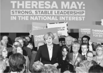  ??  ?? May delivers a speech to Conservati­ve Party members in Mawdesley village hall, Ormskirk, Britain. — Reuters photo