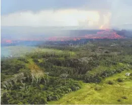  ?? AP PHOTO ?? HOT STUFF: Lava flows near Pahoa, Hawaii, on Wednesday in this aerial photo provided by the U.S. Geological Survey.