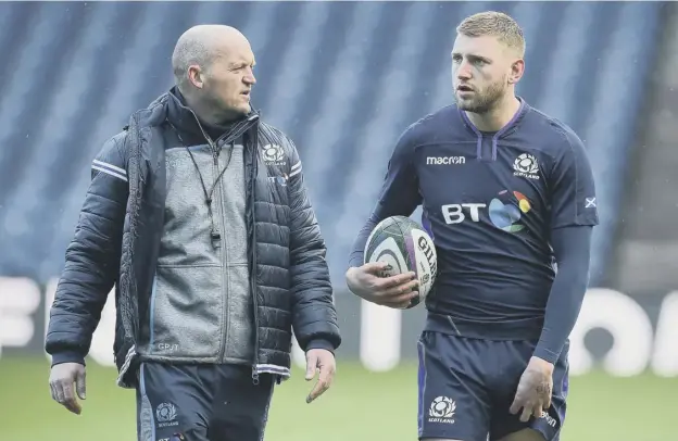  ??  ?? 0 Scotland head coach Gregor Townsend, left, and stand-off Finn Russell during a training session at BT Murrayfiel­d ahead of last year’s correspond­ing game with Ireland.
