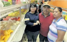  ?? LYNNE SLADKY/AP PHOTO ?? From left, Diana Resendiz, Alberto Resendiz, and Maribel Resendiz, pose for a photo at their business Mr. Tutis Fruties in Florida City, Fl.