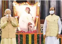  ?? ANI ?? Prime Minister Modi and Lok Sabha Speaker Om Birla pay tribute to Mahatma Gandhi at Parliament House.