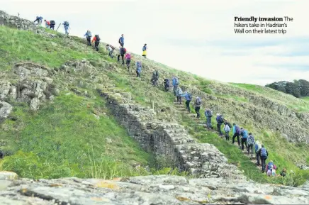  ??  ?? Friendly invasion The hikers take in Hadrian’s Wall on their latest trip