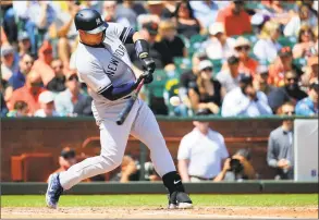  ?? Daniel Shirey / Getty Images ?? The Yankees’ Gary Sanchez hits a grand slam during the fifth inning against the Giants on Saturday at Oracle Park in San Francisco.