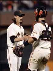  ?? PHOTO BY EZRA SHAW — GETTY IMAGES ?? Entering the 2021season, Buster Posey, right, has 140 career home runs and 673career RBIs, which are far fewer than the 932 RBIs nine-time Gold Glove Award winner Yadier Molina racked up in 17 seasons with the Cardinals.