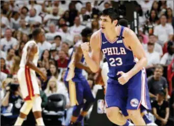  ?? JOE SKIPPER — THE ASSOCIATED PRESS ?? Philadelph­ia 76ers forward Ersan Ilyasova (23) reacts after his third-quarter score against the Miami Heat in Game 4 of a first-round NBA basketball playoff series, Saturday in Miami.