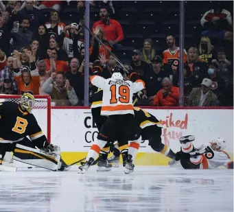  ?? AP Photos ?? PAYING THE PRICE: Philadelph­ia’s Cam Atkinson, right, scores his second goal of the game in the third period.