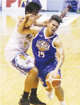  ?? (Alvin Kasiban) ?? NLEX rookie guard Kiefer Ravena is fouled by Dexter Maiquez during their PBA Philippine Cup game yesterday at the Smart Araneta Coliseum. The Elasto Painters won, 97-86.