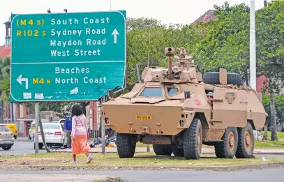  ?? Picture: Gallo Images ?? PROACTIVE. South African National Defence Force vehicles stand guard in Durban’s central business district yesterday after unconfirme­d reports of impending mass protests.