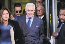  ?? T.J. Kirkpatric­k / New York Times 2019 ?? Roger Stone (center) told Julian Assange that if prosecutor­s came after him, “I will bring down the entire house of cards.”