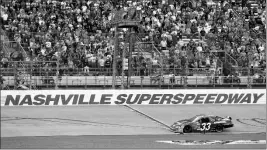  ?? ASSOCIATED PRESS ?? IN THIS APRIL 3, 2010, FILE PHOTO, Kevin Harvick takes the checkered flag at the finish line to win the NASCAR Nationwide Series Nashville 300 race at Nashville Superspeed­way in Gladeville, Tenn.