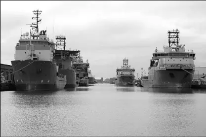  ?? REUTERS ?? Vessels that are used for towing oil rigs in the North Sea are moored at William Wright docks in Hull, Britain.