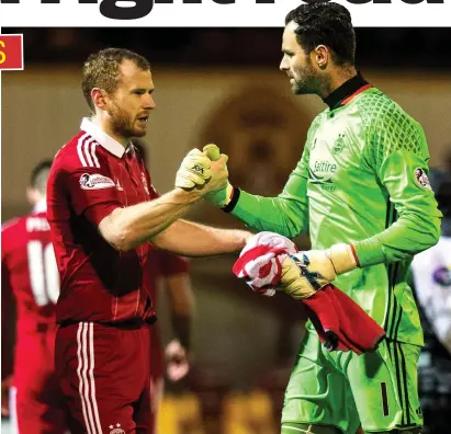  ??  ?? Brother in arms: Reynolds, left, and Dons keeper Joe Lewis savour last week’s win over Motherwell