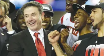  ?? | AP ?? Rick Pitino celebrates with his players after beating Michigan in the 2013 national championsh­ip.