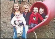  ?? SUBMITTED PHOTO ?? Kimberly Hvizda, center, with her four children.