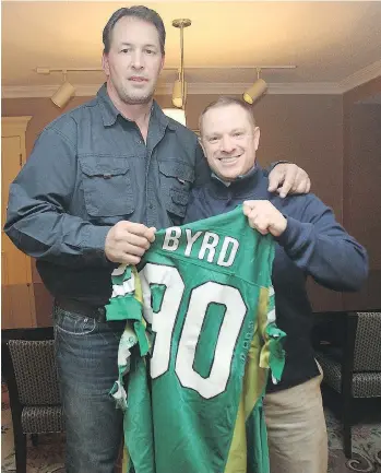  ?? BROCK SUNDERLAND ?? Dennis Byrd, left, was a hero to a young Brock Sunderland and a friend in later years before Byrd’s death in 2016. The two are holding the jersey cut off Byrd when he was paralyzed in a 1992 NFL game.