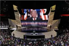  ?? Patrick Semansky/Associated Press ?? Then-presidenti­al candidate Donald Trump smiles as he addresses delegates on July 12, 2016, during the final day session of that year’s Republican National Convention in Cleveland.