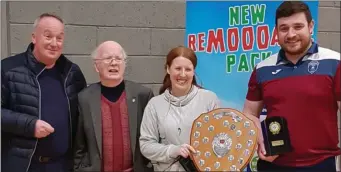  ??  ?? The winners of the Division 4 competitio­n at the Listowel Division 4 badminton tournament took place in Listowel Community Centre last Sunday. From left: James Sheehan and Junior Griffin from Listowel presenting the Division 4 Mixed Double Shield to Becky Weiland, Listowel, and Niall O’Hanlon, Causeway.