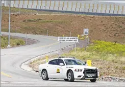  ??  ?? GETTY A Utah Highway patrol car guards the entrance at the National Security Agency’s new spy data collection center in Bluffdale, Utah., just south of Salt Lake City.