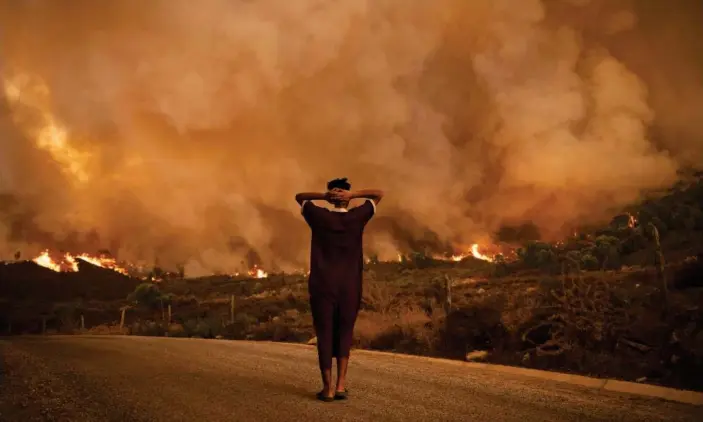  ?? Photograph: Fadel Senna/AFP/Getty Images ?? Wildfires tearing through a forest in the Chefchaoue­n region of northern Morocco.