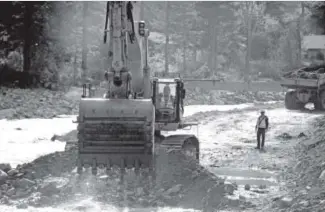  ?? Helen H. Richardson,the Denver Post ?? An excavator pulls rock and dirt out of the Big Thompson River near Drake onWednesda­y to divert the river back to where it used to flow. State and contract crews are also working on U.S. 34 to provide a temporary road by Dec. 1.