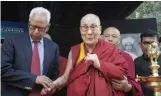  ?? — SONDEEP SHANKAR ?? Former governor of Jammu and Kashmir N.N. Vohra holds hands of Tibetan spiritual leader the Dalai Lama as he arrives to deliver S. Radhakrish­nan Memorial lecture at India Internatio­nal Centre in New Delhi on Thursday.