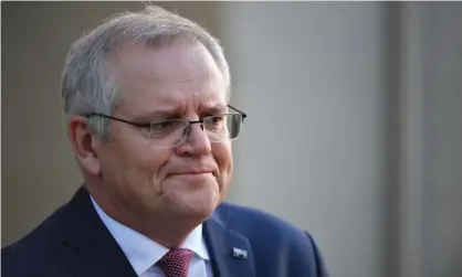  ??  ?? Australian prime minister Scott Morrison’s language on achieving net zero by mid-century has warmed considerab­ly since Joe Biden won the US election. Photograph: Mick Tsikas/EPA