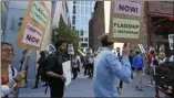  ?? SAMANTHA MALDONADO- THE ASSOCIATED PRESS ?? In this photo taken July 16, 2019, tech workers march to support Facebook’s cafeteria workers, who were rallying for a new contract with their company Flagship in San Francisco.