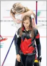  ?? AP PHOTO/NATACHA PISARENKO ?? Canada’s skip Rachel Homan, center, leaves the ice after loosing a women’s curling match against Britain at the 2018 Winter Olympics in Gangneung, South Korea, Wednesday.