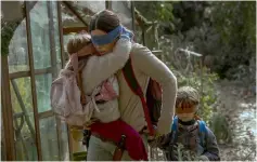  ??  ?? (Above and below) Bullock plays a woman trying to guide two small children to safety in the post-apocalypti­c thriller ‘Bird Box’. — Courtesy of Netflix