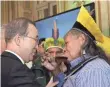  ?? ERIC FEFERBERG, AFP/GETTY IMAGES ?? U.N. chief Ban Ki Moon with Brazilian indigenous rights activist Raoni Metuktire in Paris on Sunday.