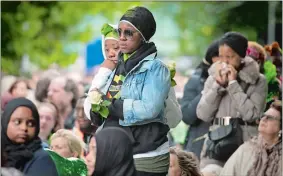  ?? STEFAN ROUSSEAU/POOL PHOTO VIA AP ?? People attend a service of remembranc­e in west London on Thursday, the one-year anniversar­y of the Grenfell Tower fire, which killed 72 people.