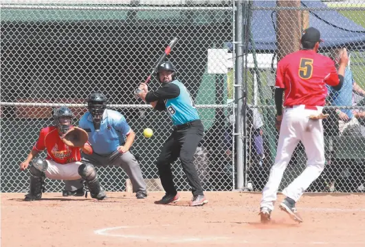  ?? Citizen photo by James Doyle ?? Jared Potskin of the Prince George Rivers Kings eyes up a pitch thrown by Westbank Cardinals’ Caleb Keeshig during the 2016 Canadian Native Fastball Championsh­ips in Prince George.