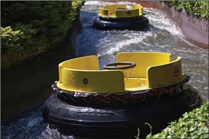  ??  ?? Deserted: Empty boats are sent round the Congo River Rapids, normally a popular attraction at the park