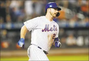  ?? Kathy Willens / Associated Press ?? Pete Alonso of the Mets runs out his fifthinnin­g solo home run against the Diamondbac­ks on Monday in New York. Alonso had two homers in the 31 win.